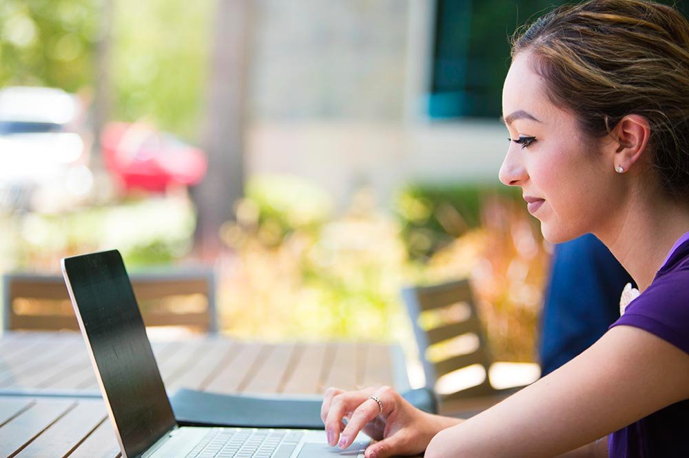 a lady evaluating her study strategies on a laptop 